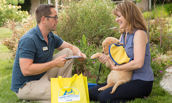 Puppy raiser receives puppy and puppy package