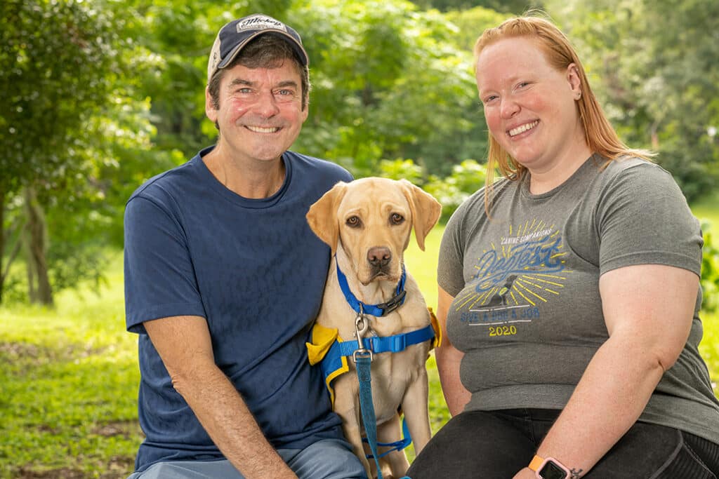 Two people with puppy