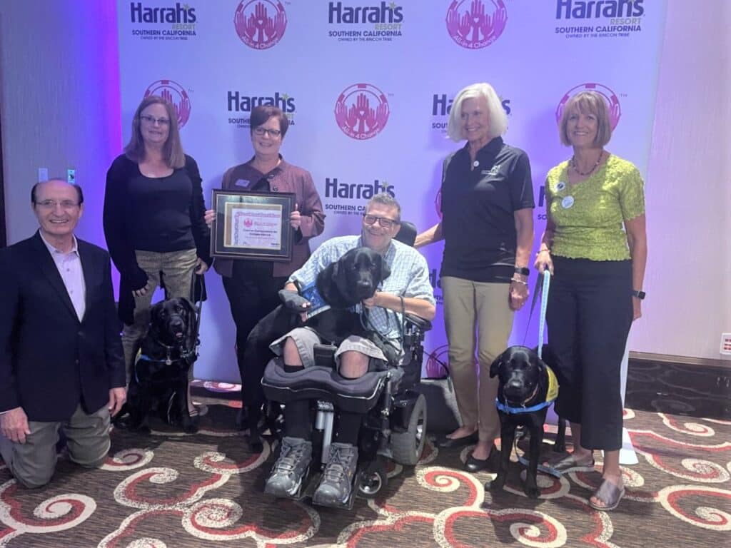 Group of people holding award pose for a photo.