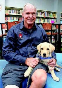 Canine Companions volunteer puppy raiser Mike Hartsky with Scooby II